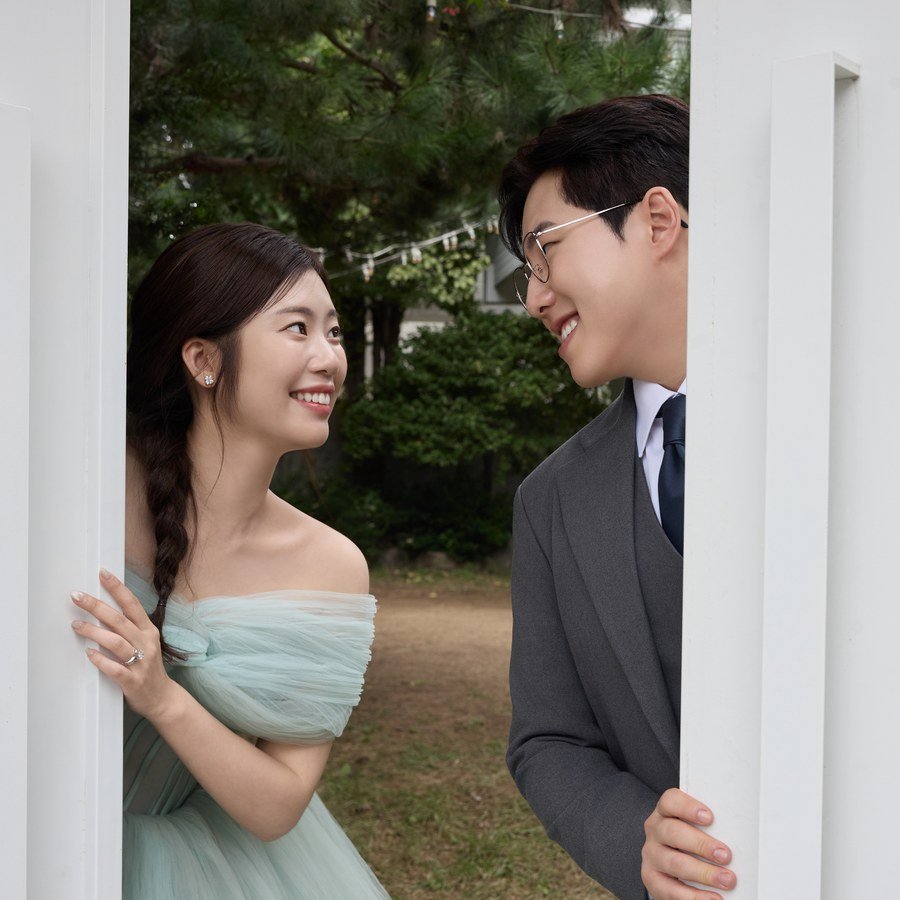 Jake and Lindsey peeking through a garden doorway